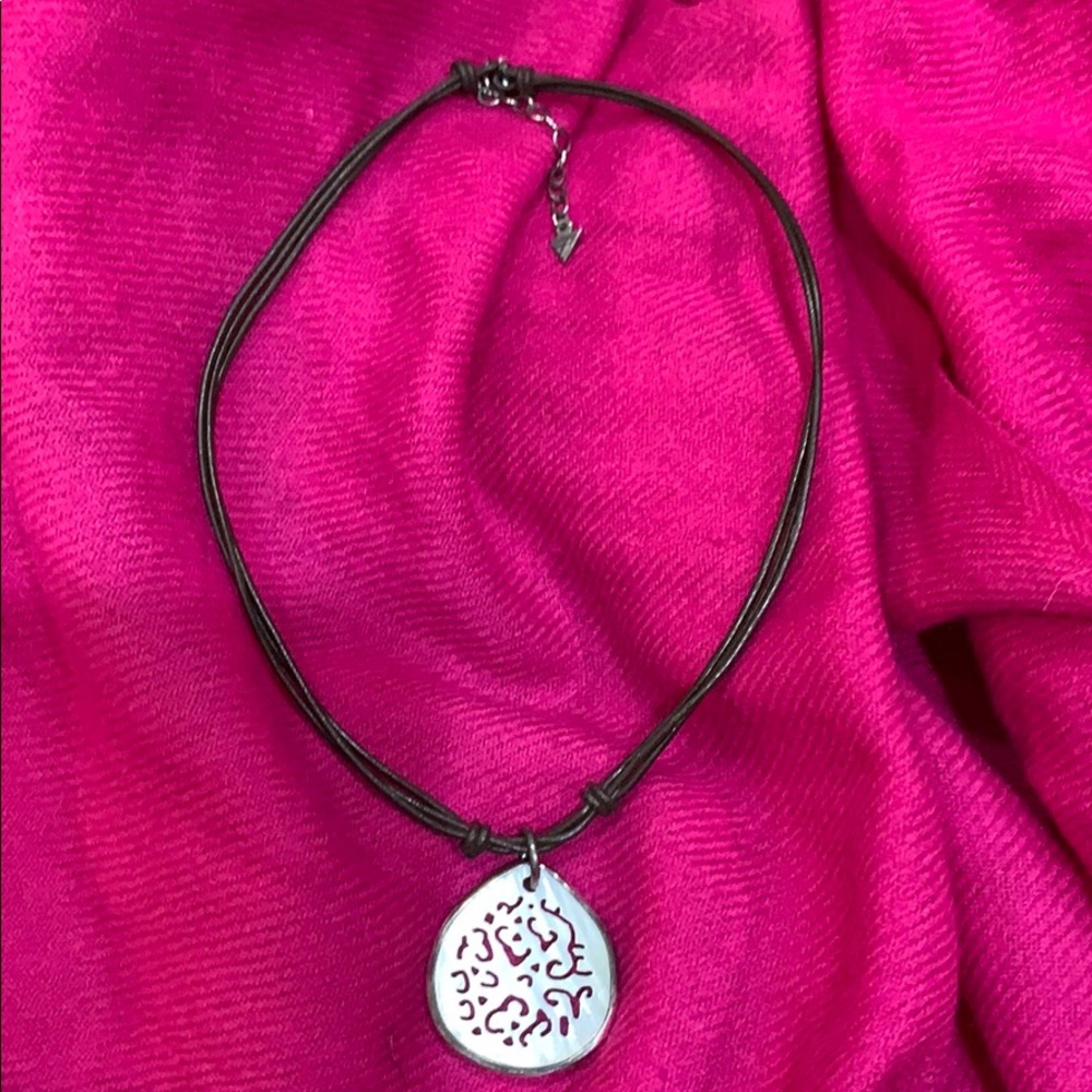 Carved Mother of pearl and brown leather necklace